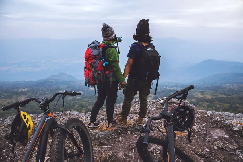 asian lover women and men travel nature. travel relax ride a bi